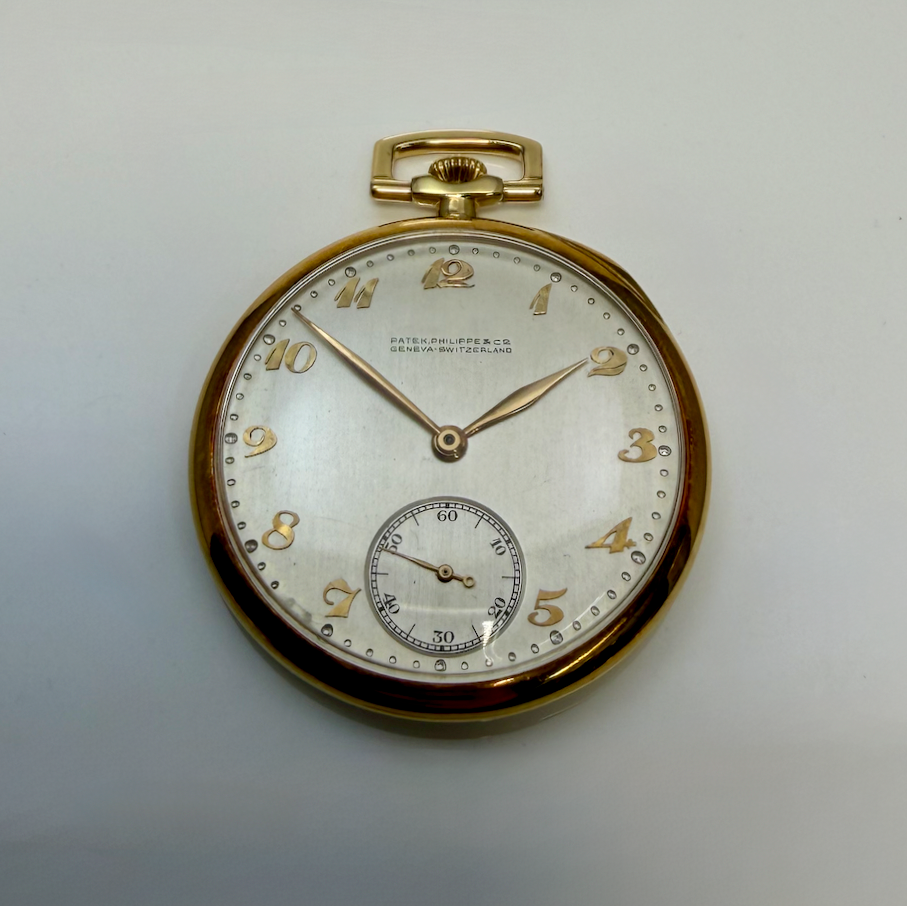 Patek Philippe pocket watch on a white background